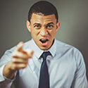 Man pointing finger with a serious expression