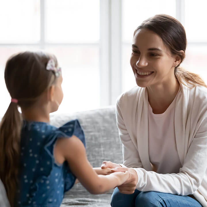 Adult and child in a calm, connected moment, illustrating the value of stepping back to support growth without pressure.