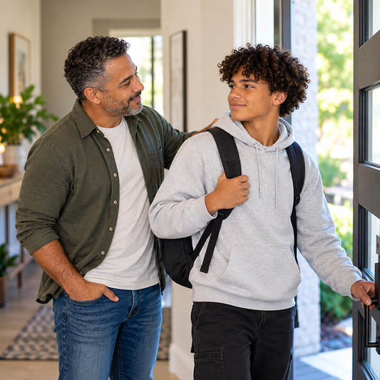 Father talking with his teenage son about independence and responsibility as he leaves home
