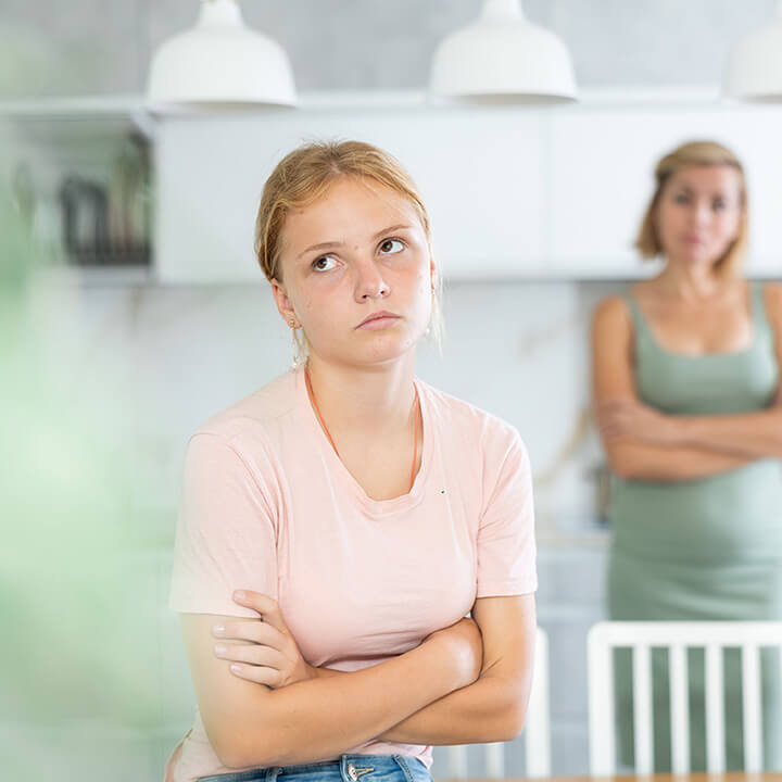 Parent handling back talk and disrespectful behavior from a teenager using calm parenting techniques